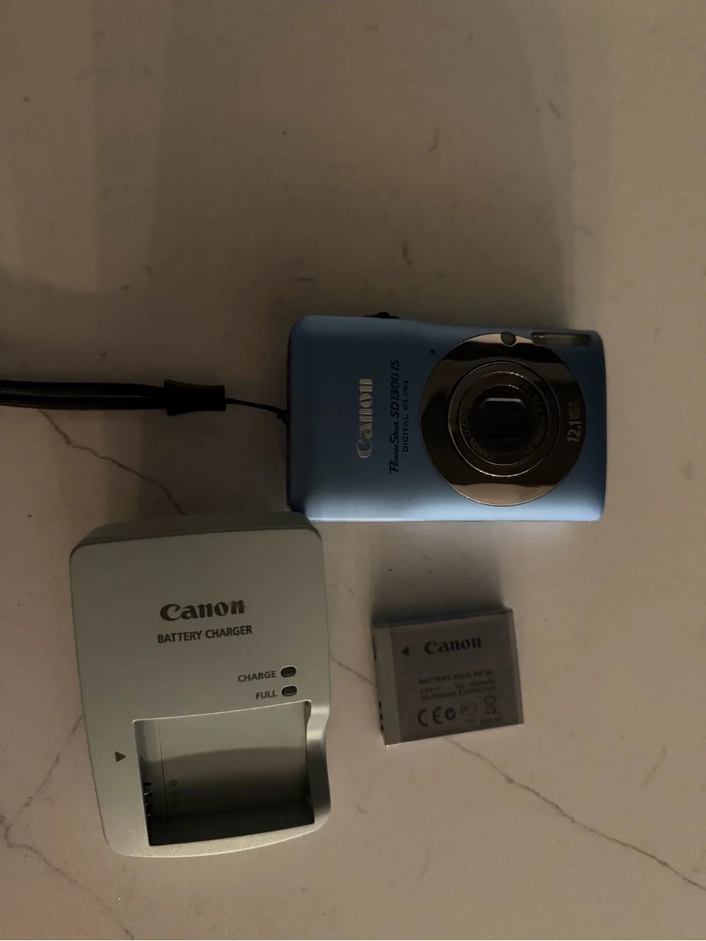 Canon Power Shot SD1300 IS digital camera features a 12.1-megapixel CCD sensor